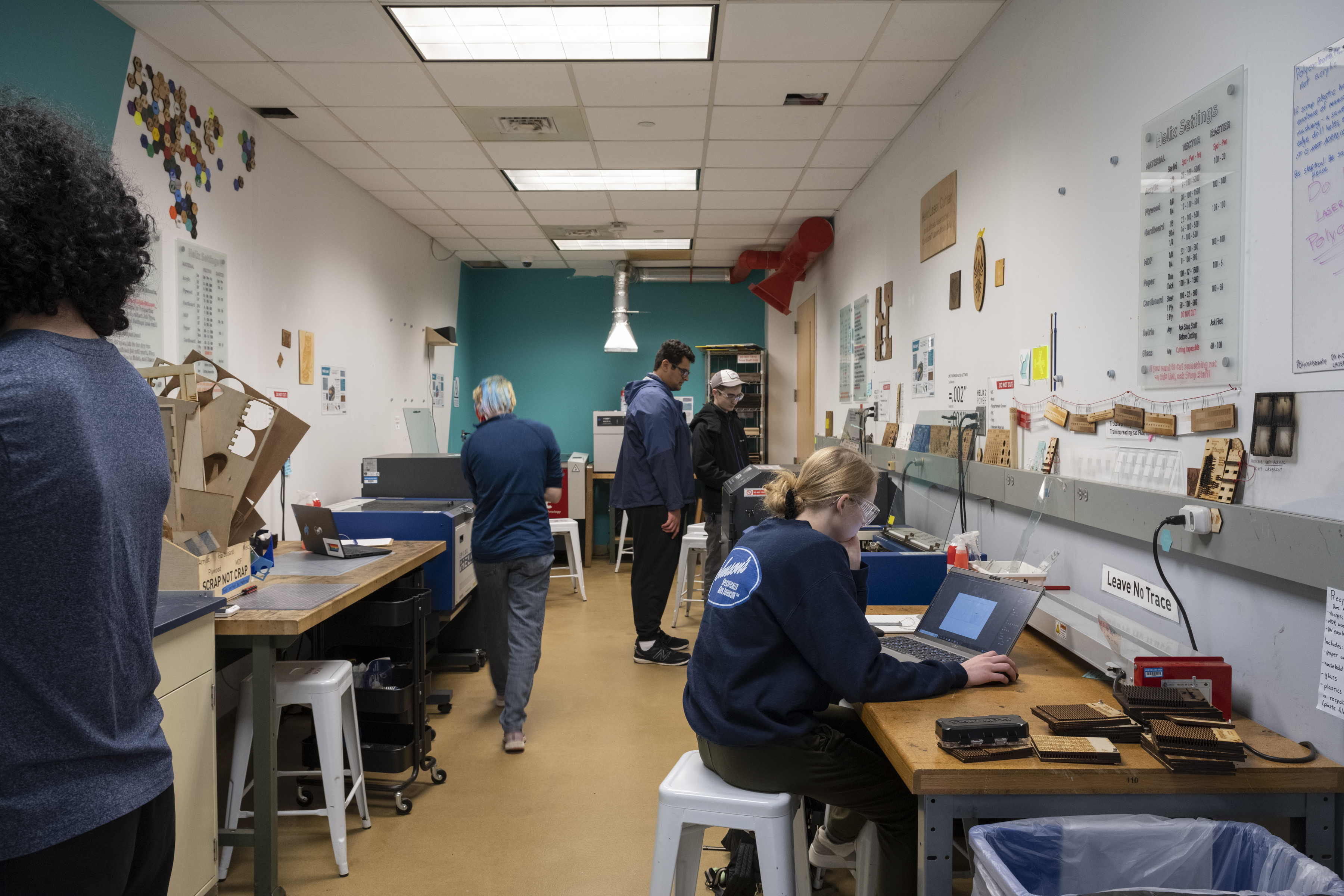 students working in the laser shop 