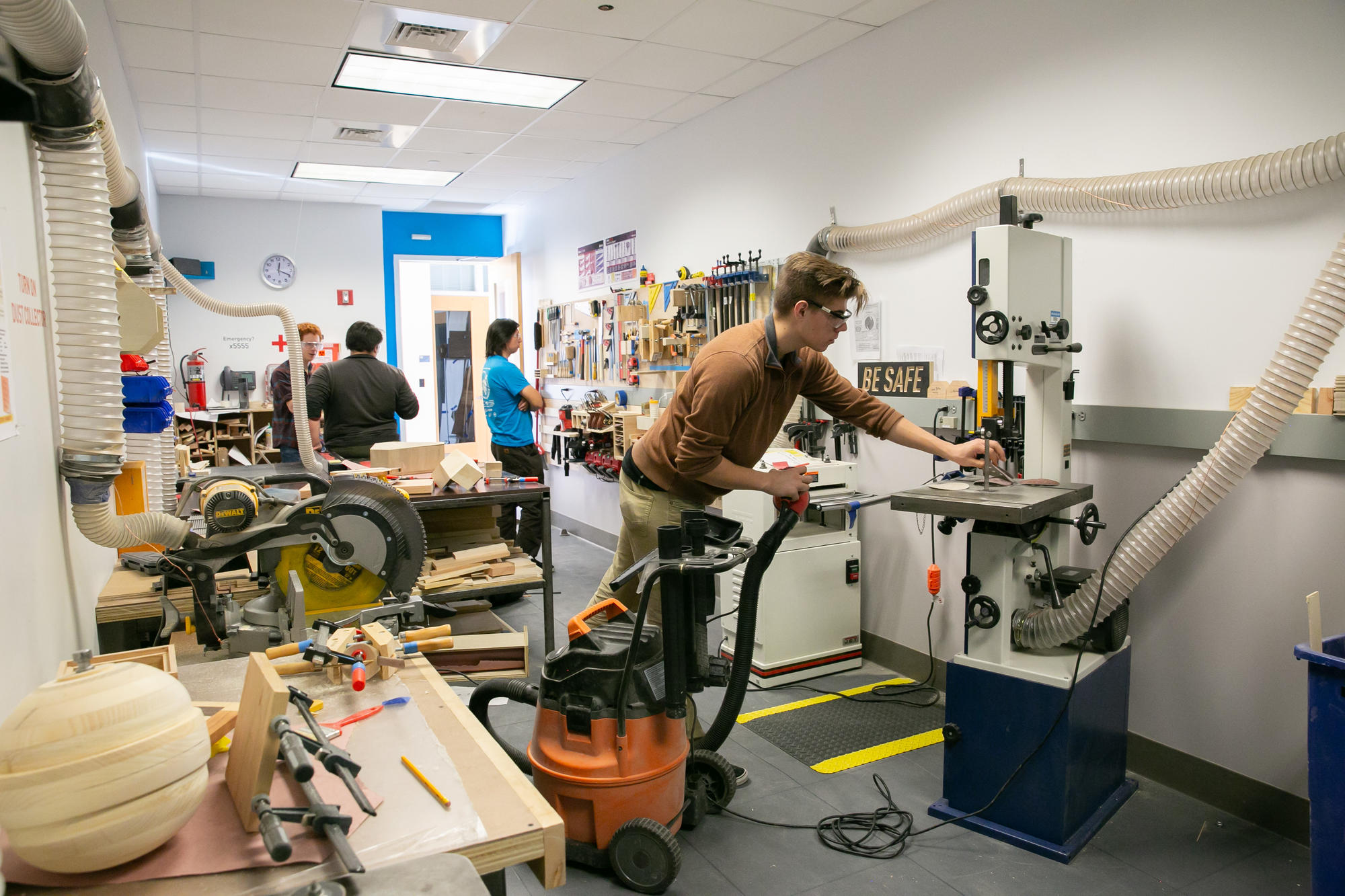 image of 2 students working together on machines in electronics shop