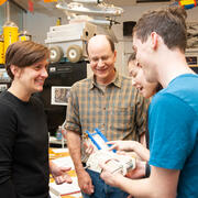Dave Barrett (Center) &amp; Daniella Faas (Left) talk with students in 2019