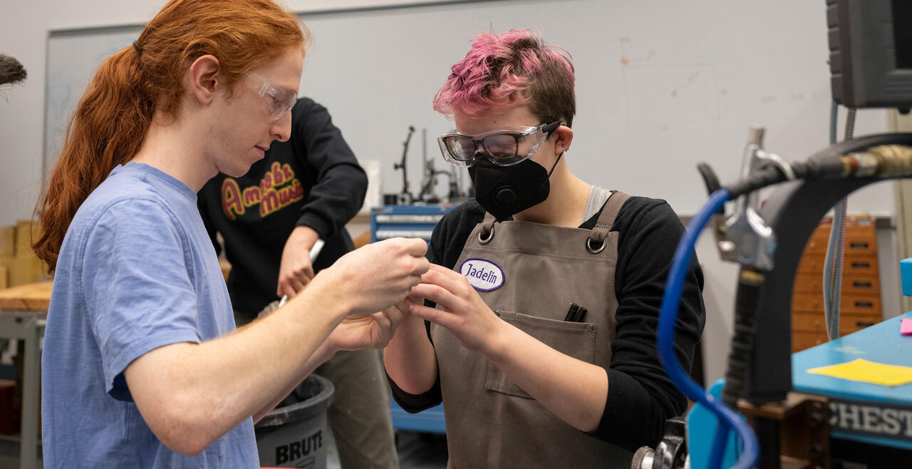 A student helps another in the Olin Shop during the Fall 2022 semester.